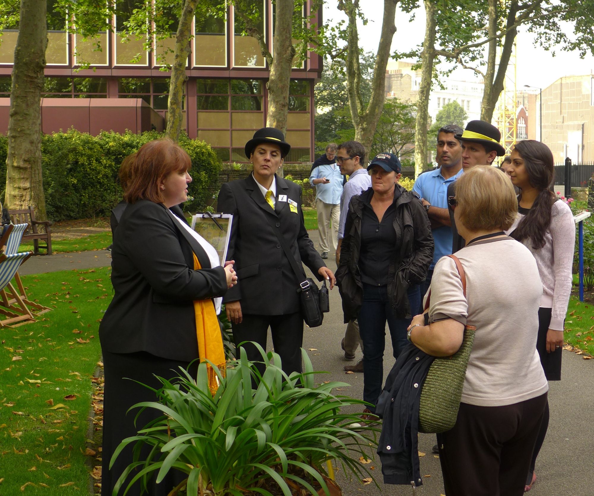 Tina leading a tour to a small group in Paddington Street Gardens in Marylebone